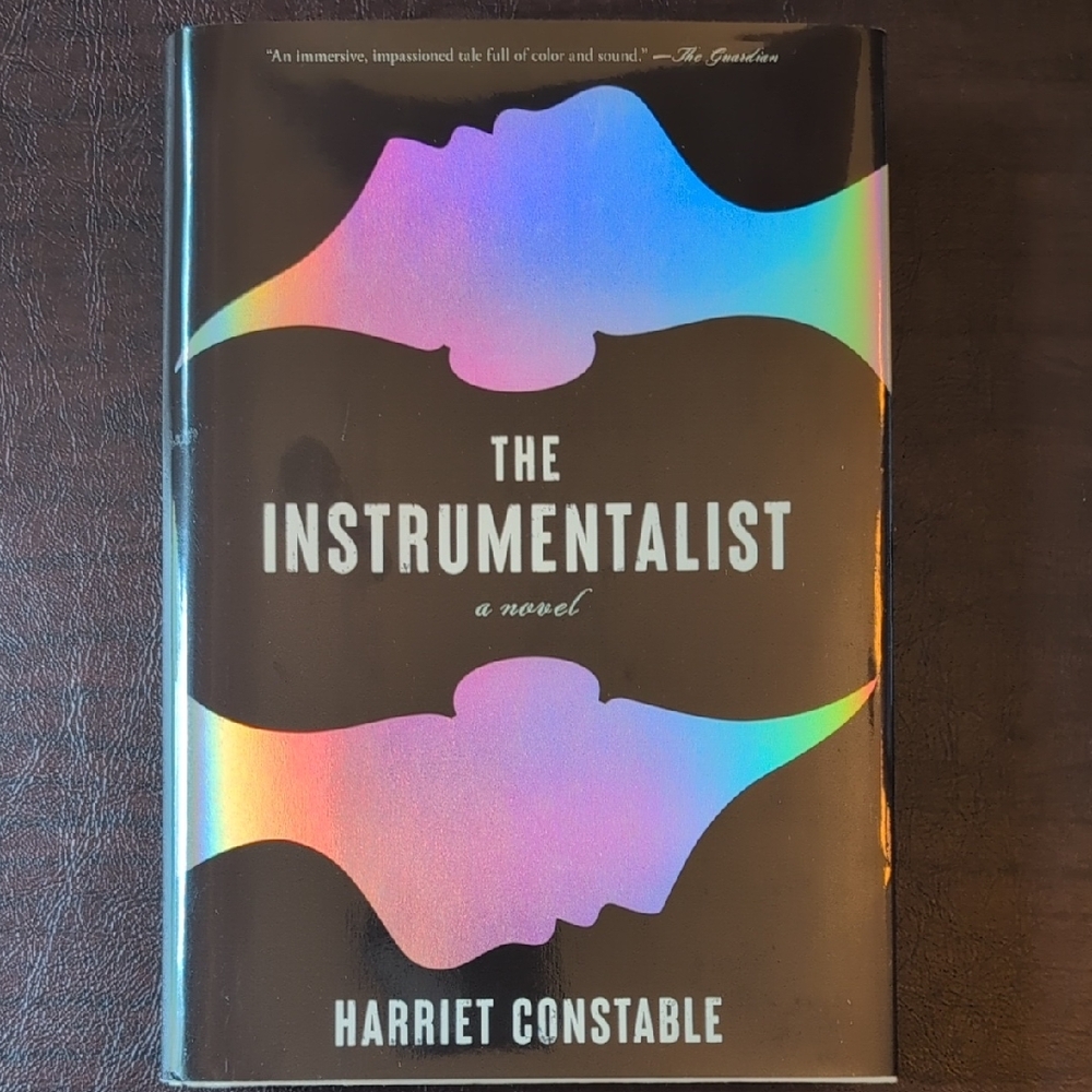 The Instrumentalist Novel with Holographic Cover
